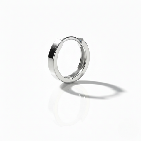 Silver hoop earring on a white background