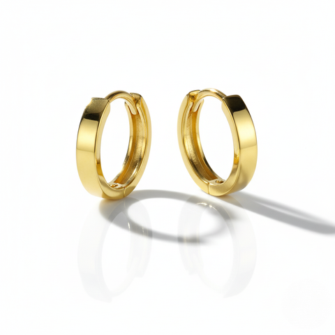 Pair of gold hoop earrings on a white background