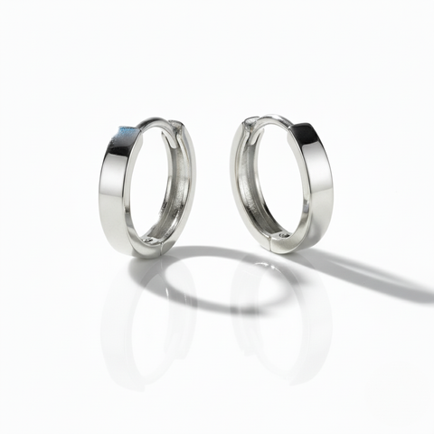 Pair of silver hoop earrings on a white background
