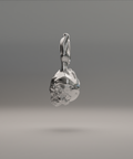 A silver and gold pendant in the shape of a flame with an intricately detailed skull design within it.