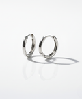 White gold minimal and rounded hoop on a white background